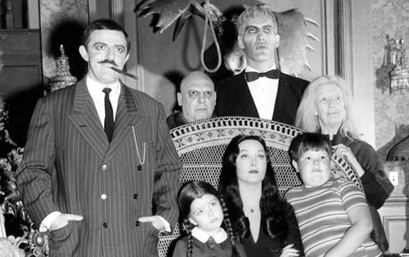 Unraveling the Greatest Horror TV Shows in American History 9 photograph of the original Addams Family show cast in full character dress